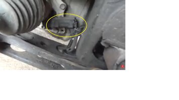 is this the transfercase encoder motor though the wheel well.jpg